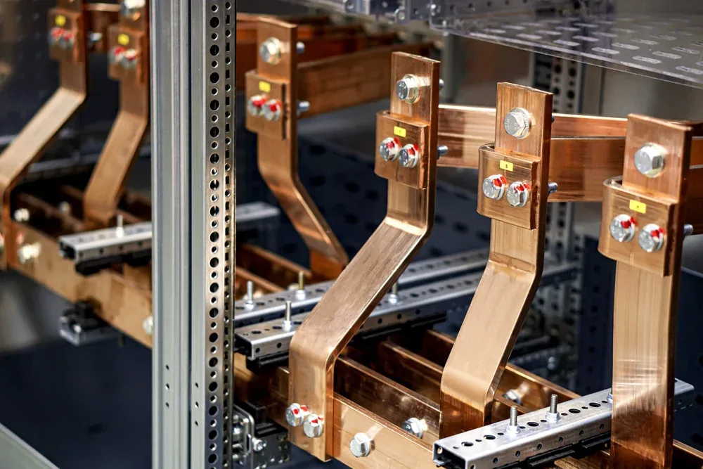 Copper bus bars inside electrical switchgear